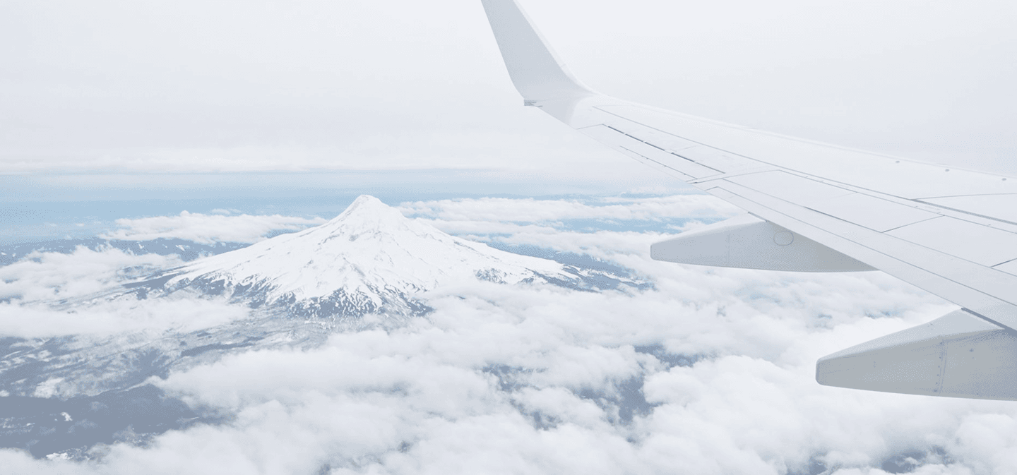 Aerial view of clouds and mountains from an airplane